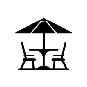 Silhouette of two chairs and a table with an umbrella, suggesting an outdoor seating area.